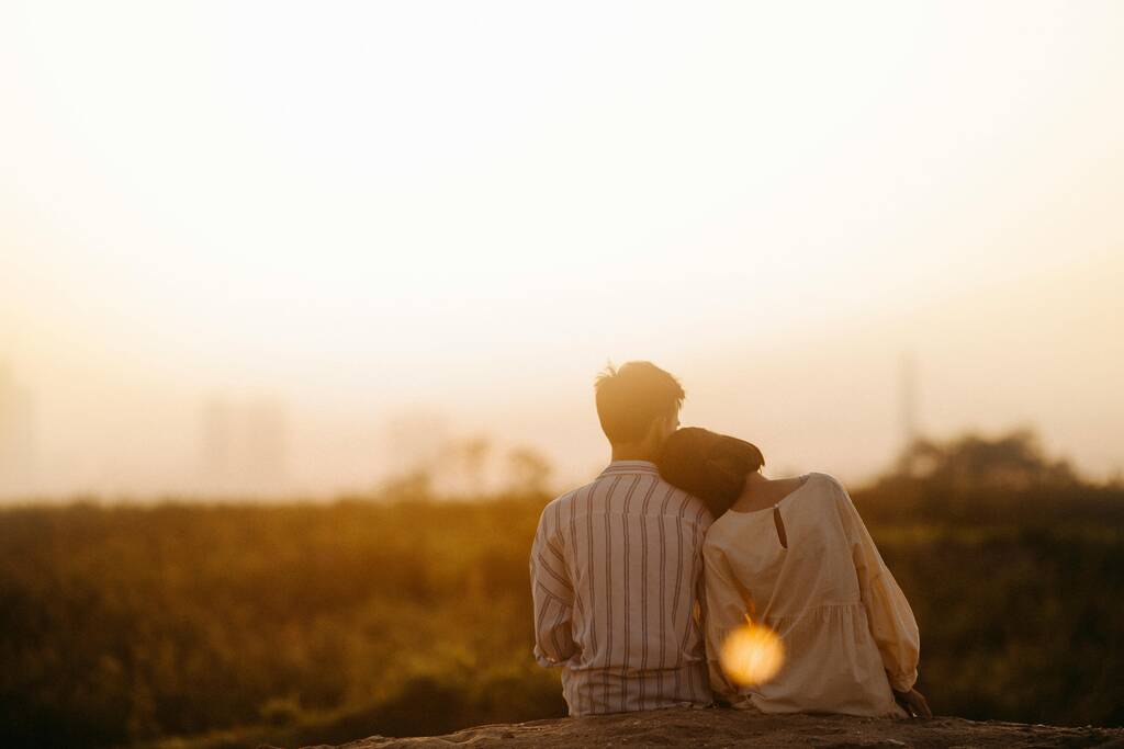 pexels-photo-1415131-1415131 Man and Woman Near Grass Field